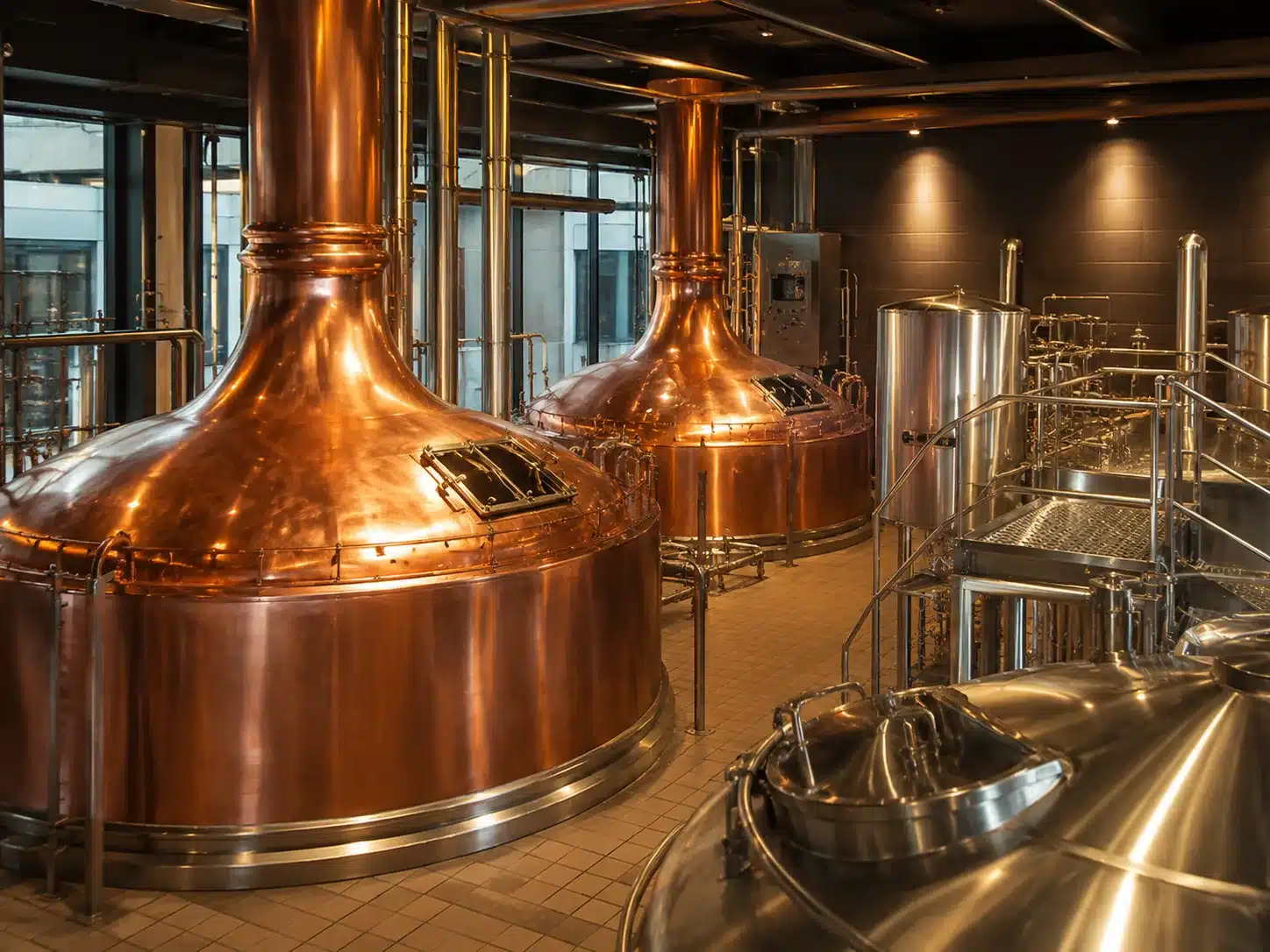 Brewhouse with copper brew kettles and stainless steel tanks