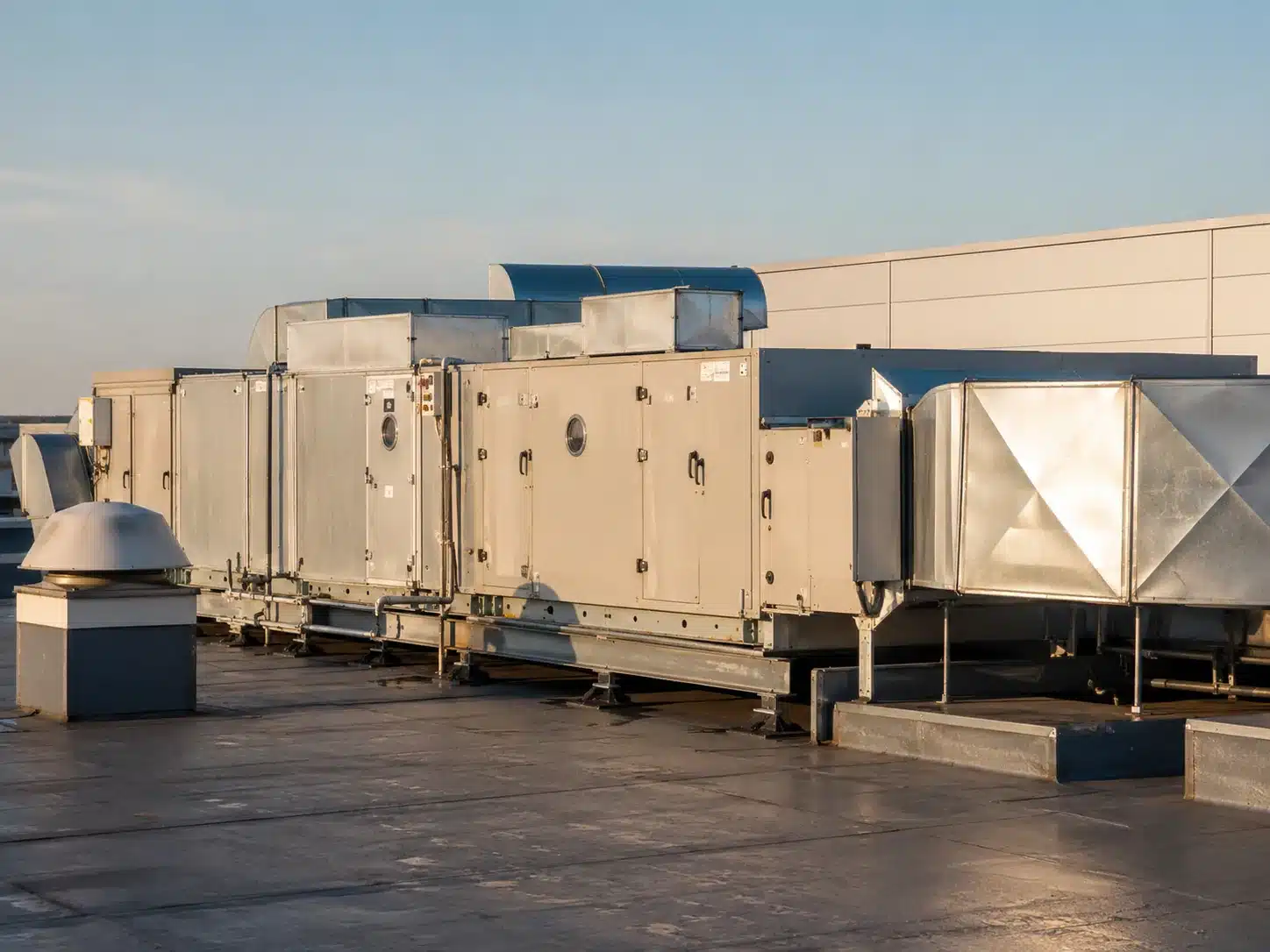 Rooftop air-handling units and ductwork in a commercial ventilation system